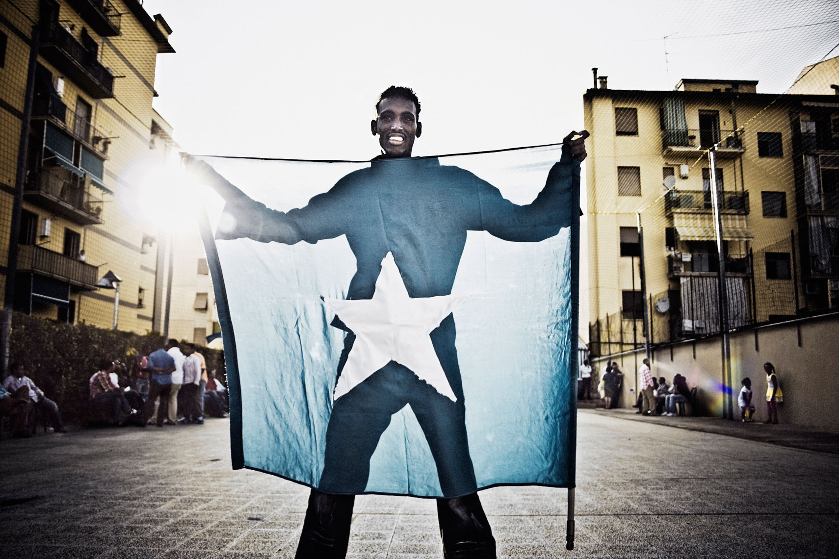 ITALY. Florence,  4th July 2010. During the celebrations for the 50th anniversary of the Somalia's indipendece day (1st July 1960) a refugee shows a Somali flag.