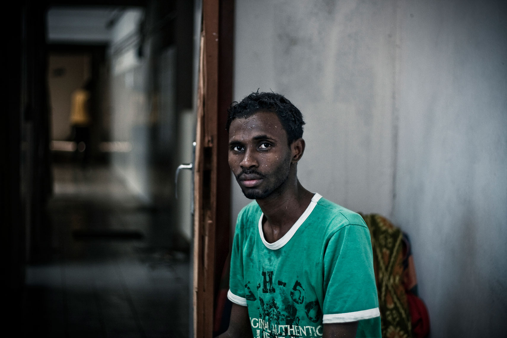 ITALY. Florence, 21st July 2009. A somali refugee inside the "Kulanka" building. "Kulanka" (assembly in somali langauge) is a former warehouse near the railways, occupied in 2008 by a group of somali refugees together with an association that helps people without home, and gived,  in 2009 , for free temporary loan for use to an association of refugees, in according to a deal signed together with the city mayor.