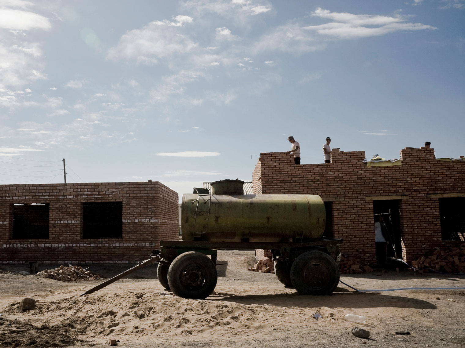 MONGOLIA.  Gobi desert, 2012. Construction works in a village.