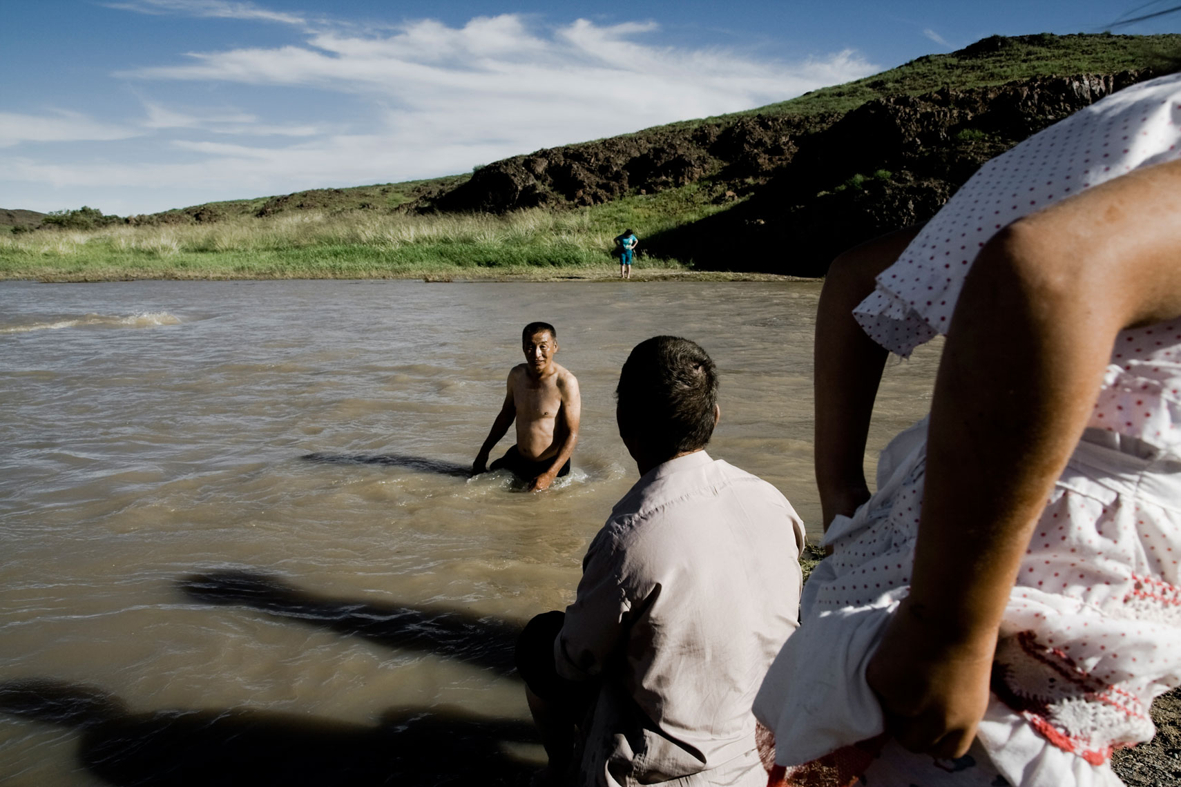 MONGOLIA,2012. Near Ongiin Khiid monastery. Some people enjoy a swim in the Ongi gol river.