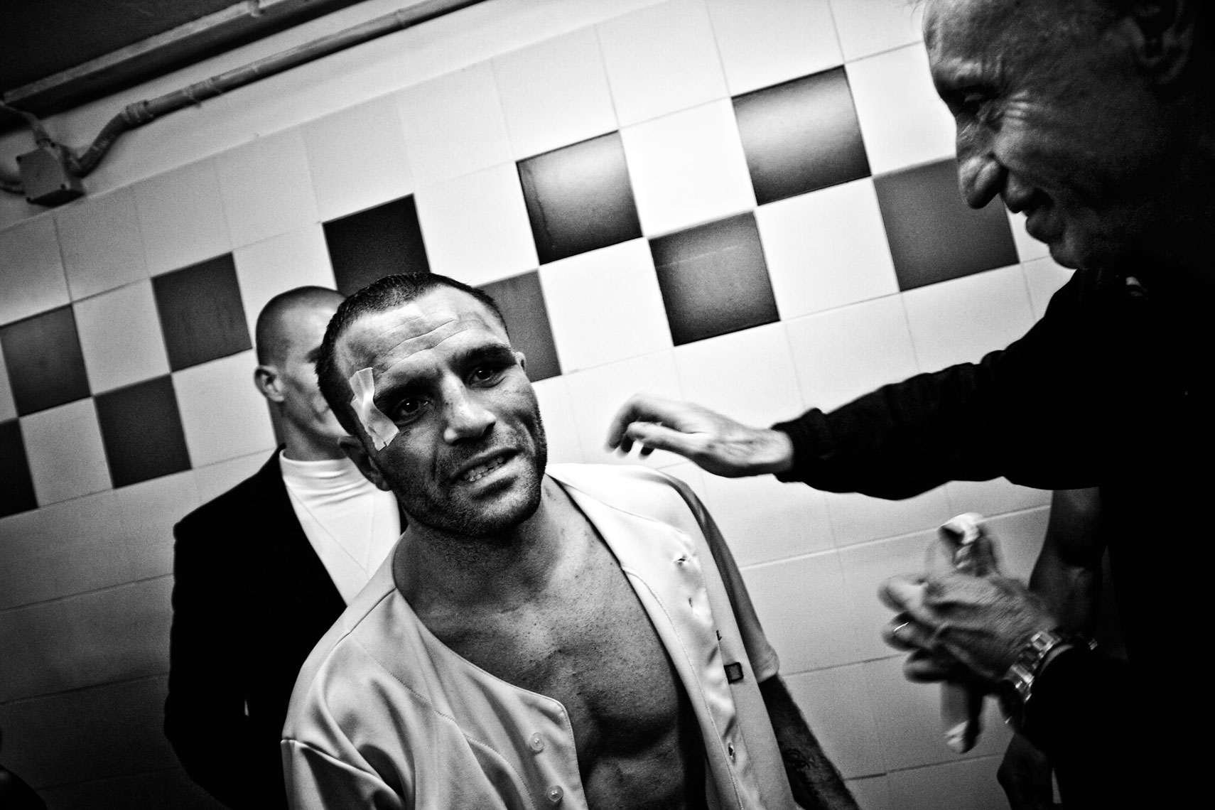 ITALY. Florence, 4th November 2011. Mandela Forum, the night of the match for the EBU (European Boxing Union) Welter Weight crown. Daniele Petrucci comes in the locker room to congratulate for Leonard Bundu's victory. Alessandro Boncinelli, Leonard's master and trainer, welcomes him.